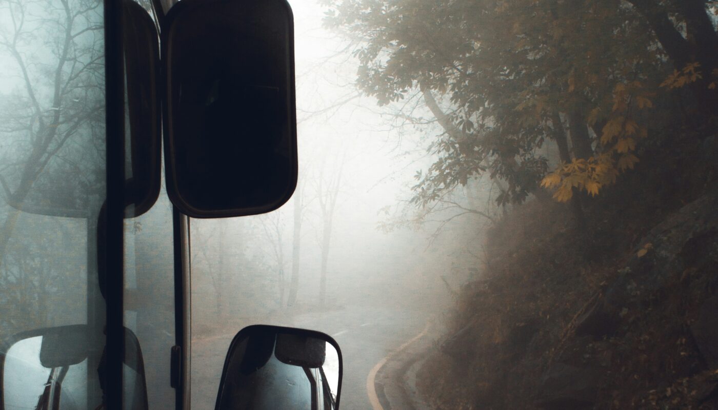 https://unsplash.com/photos/black-vehicle-on-road-surrounded-with-green-trees-in-foggy-day-uaTGkrAU5nQ